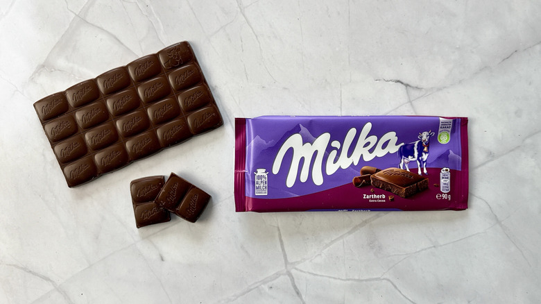 Milka Dark bar on white marble