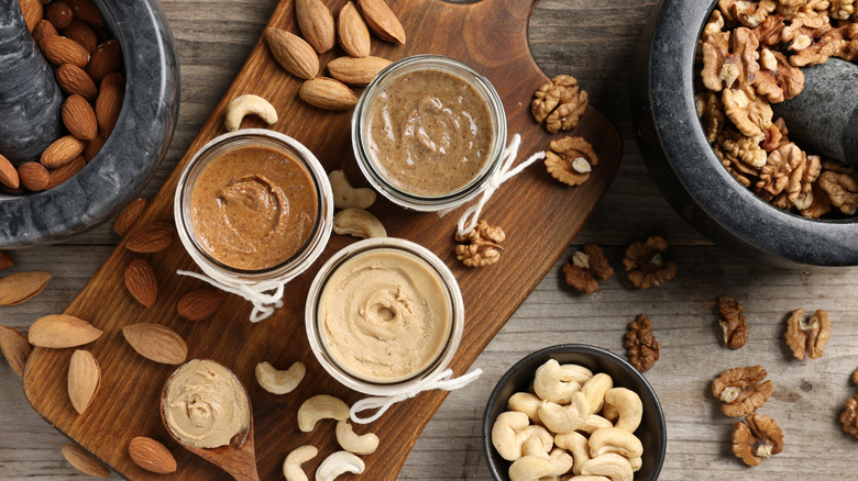 selection of nut butters with almonds walnuts and cashews