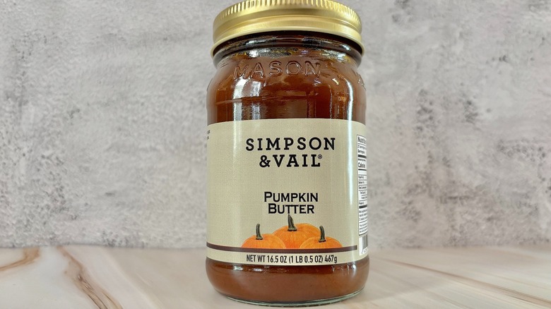 Jar of Simpson & Vail pumpkin butter on grey background