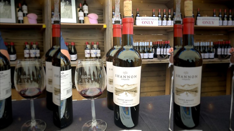 bottles and glass of red wine