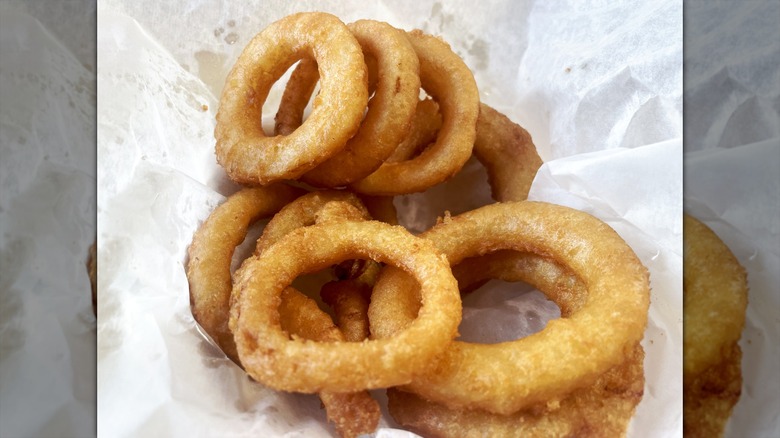 Onion rings on parchment paper