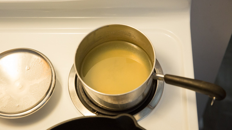 broth heating in small saucepan