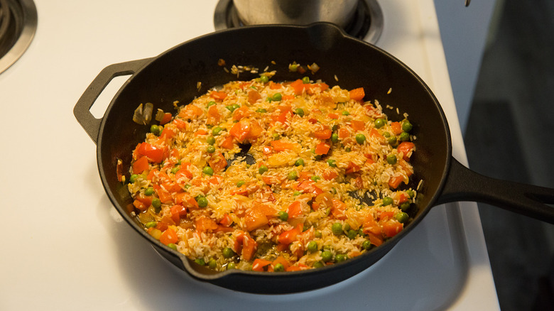 rice and vegetables in skillet