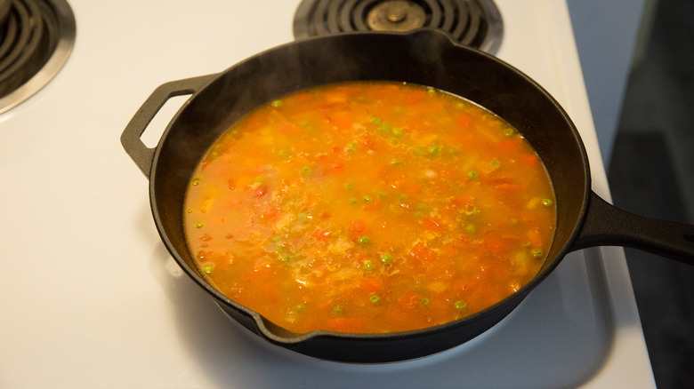 rice and broth in pan