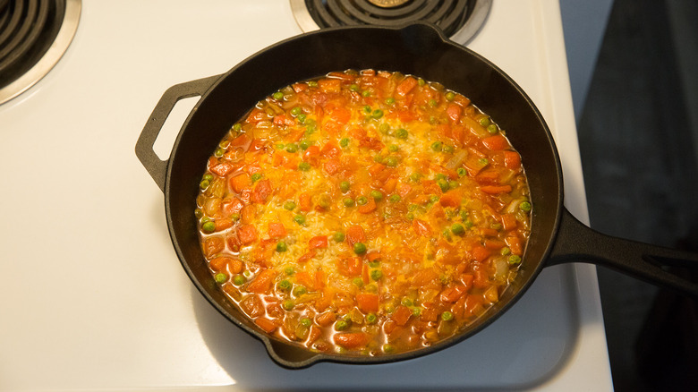rice dish simmering in pan