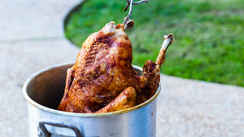 turkey being pulled from fryer