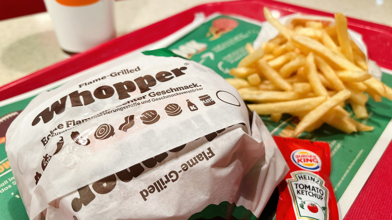 A Whopper and fries from Burger King on a tray