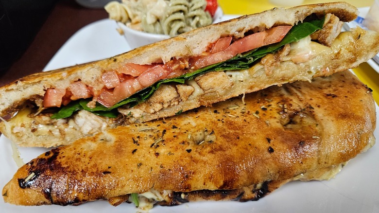 Plated chicken and tomato sandwich