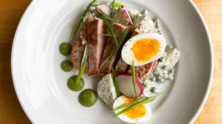 Elegantly plated seared ahi and soft-boiled egg