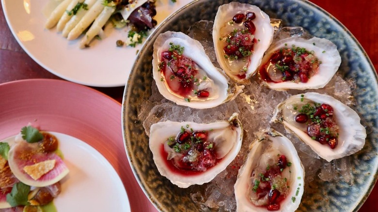 Plated oysters with pomegranate seeds
