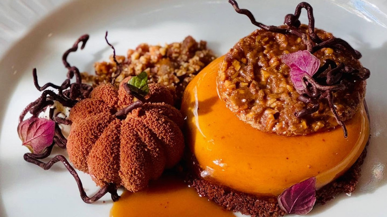 Plated pumpkin ganache with tamarind caramel and pumpkin seed nougatine