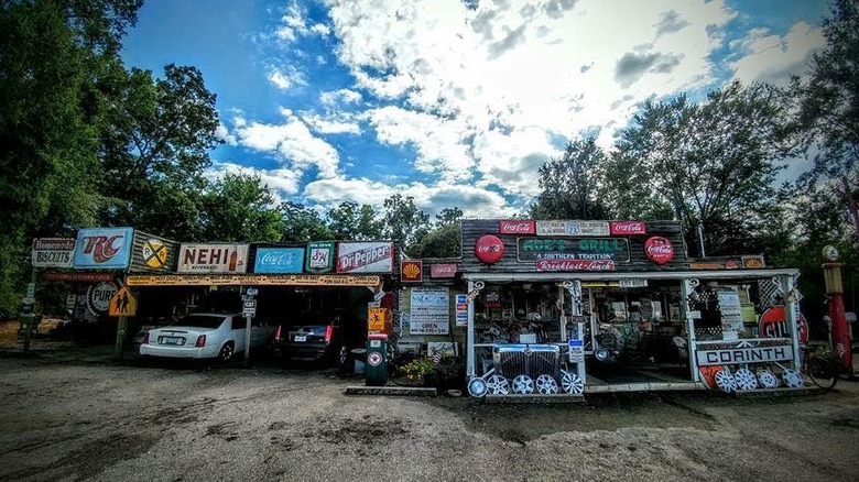 Quaint, vintage exterior of Abe's Grill with parked cars