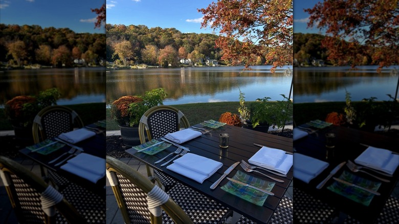 Set table with lush lake view