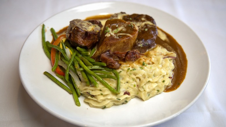 Plated bison ossobuco and green beans