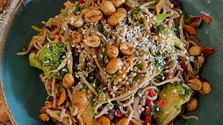 Top view of salad sprinkled with peanuts and sesame seeds
