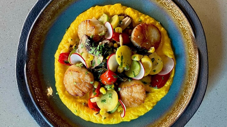 Carrot purée with corn, mushrooms, tomatoes, and braised greens