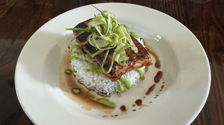 Plated grilled salmon on rice