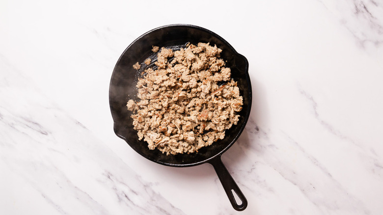 Skillet with cooked turkey