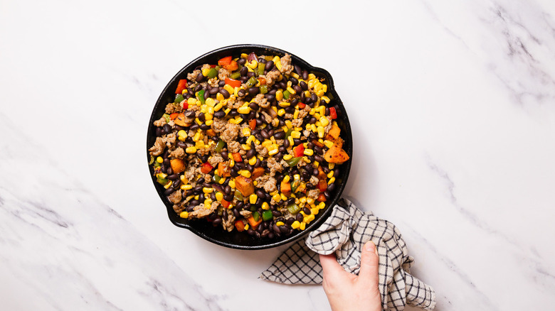 Skillet with cooked turkey and veggies