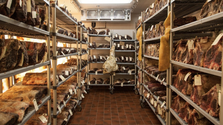 Steaks on racks aging in room