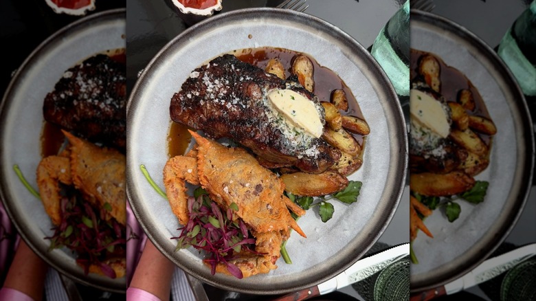 A plate of steak, potatoes, and crab at Snuff Mill