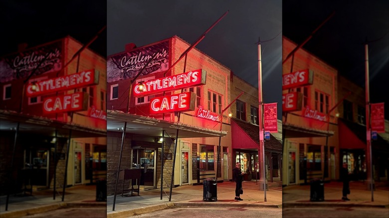 Exterior view of Cattlemen's Steakhouse at night with the sign illuminated in red