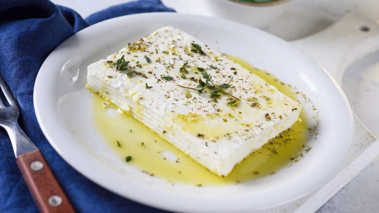 feta cheese in dish with olive oil