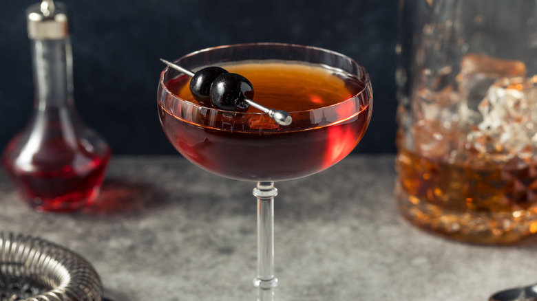 Manhattan cocktail in a coupe glass on a bartop