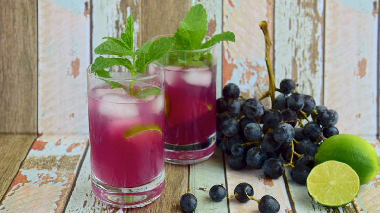 Grape drinks with mint sprigs