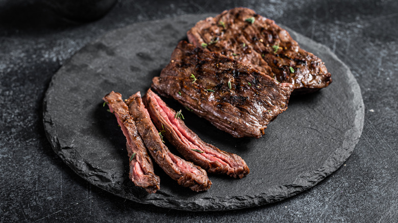 Grilled skirt steak sliced on a platter