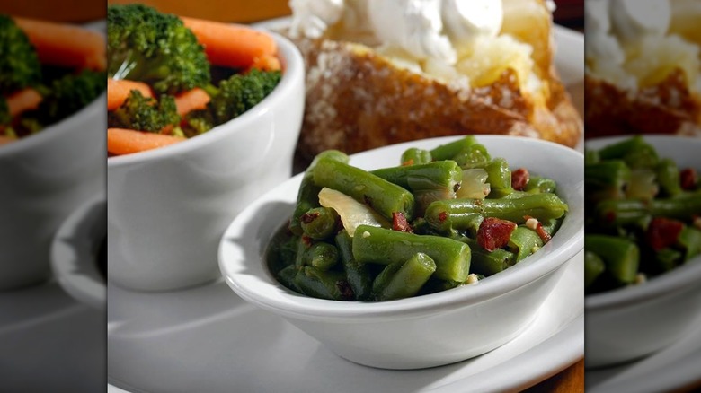 View of green beans and baked potato