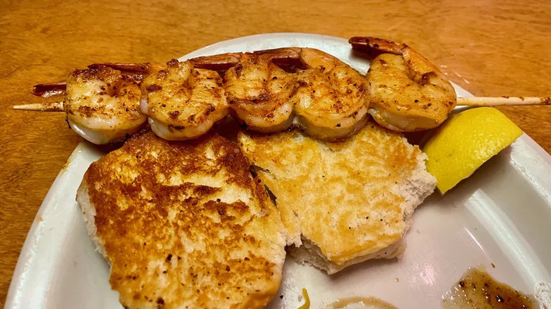 Grilled shrimp on a plate with lemon