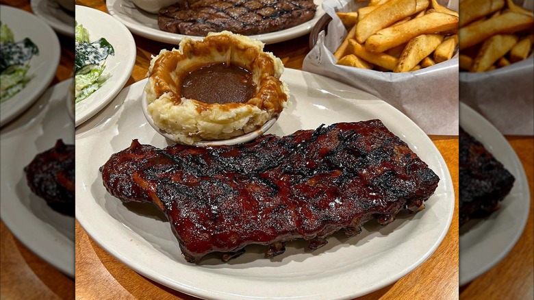 Ribs with side of mashed potatoes on plate