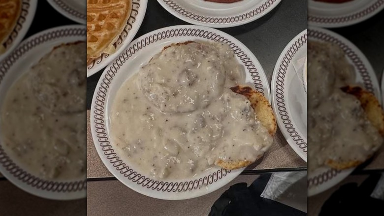 Biscuits and gravy on white plate at Waffle House