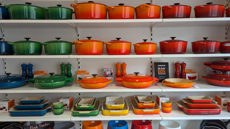 Shelves of various Le Creuset cookware