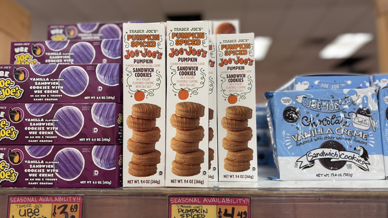 Trader Joe's pumpkin spiced Joe-Joe's on shelf surrounded by various other cookie packages