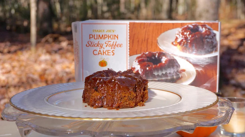 Trader Joe's pumpkin sticky toffee cakes box next to toffee cake on plate
