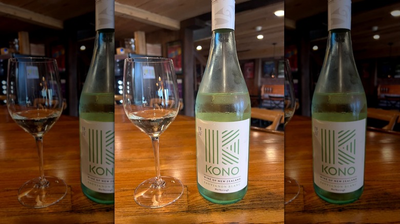 Kono Sauvignon Blanc in glass on wooden table