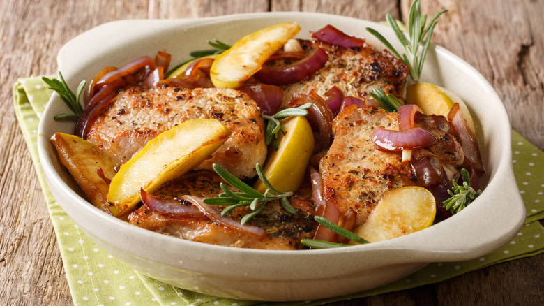 Dish with pork roast, onions, and apples