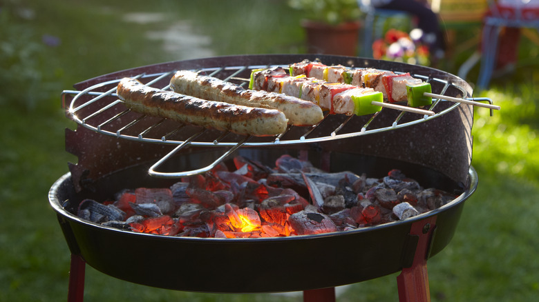 charcoal grill outside with food