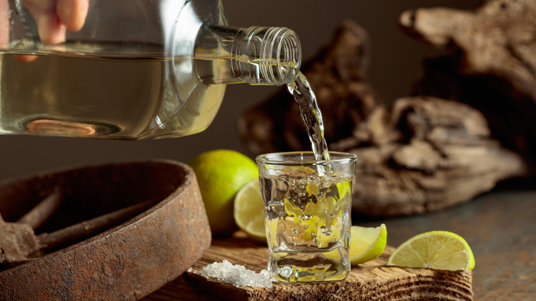 tequila bottle pouring into shot glass