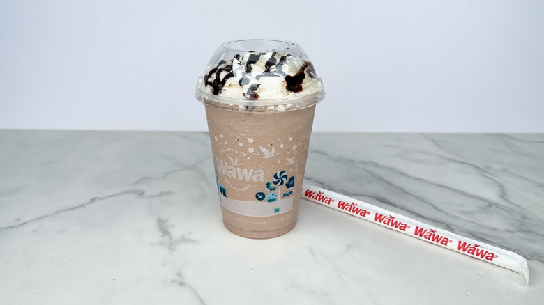 milkshake with straw on counter