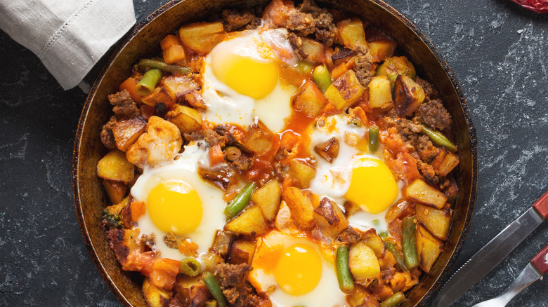 hash with egg in skillet