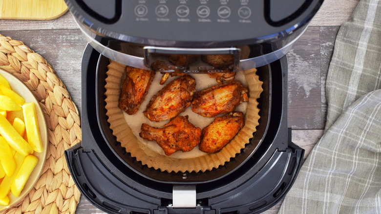 Chicken wings in an air fryer.