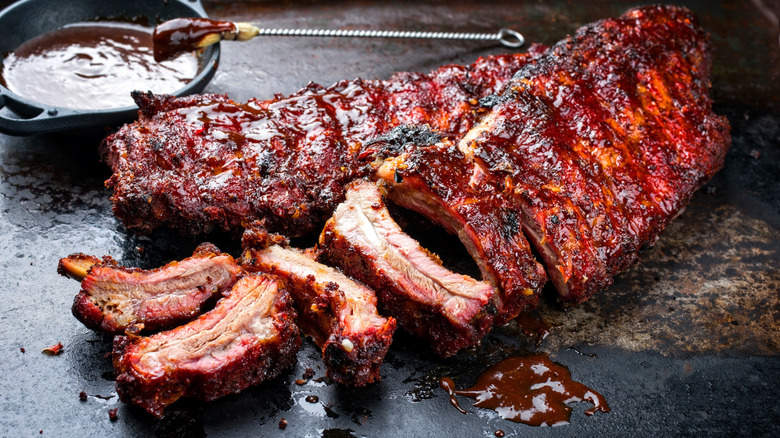 rack of barbecue ribs partially sliced