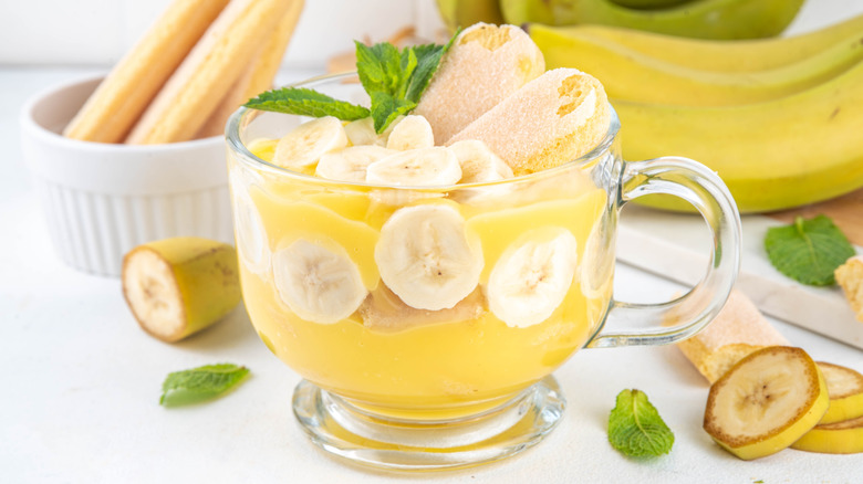 layered banana pudding dessert in glass bowl