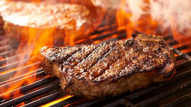 steak cooking on a grill