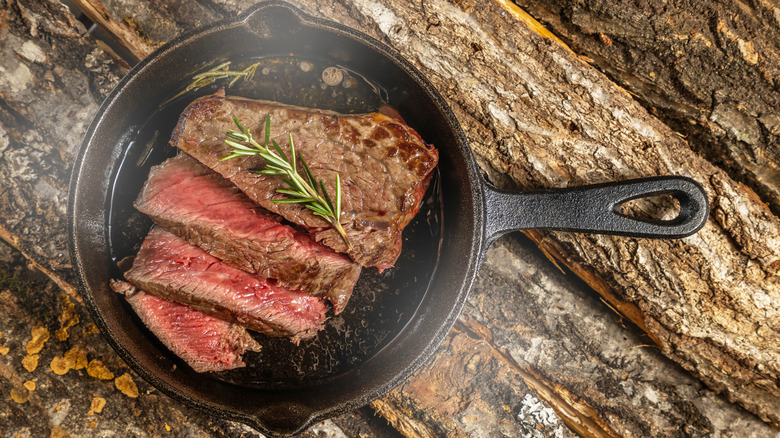 Steak in a cast iron skillet.