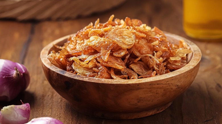 fried shallots in a wooden bowl