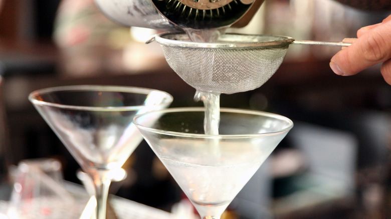 gin poured into martini glasses